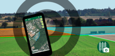 Smartphone zur Foto-Erfassung mit landwirtschaftlich genutzten Feldern im HintergrundFelder